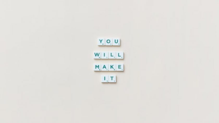 Motivational phrase 'You Will Make It' made from Scrabble tiles on a neutral background.